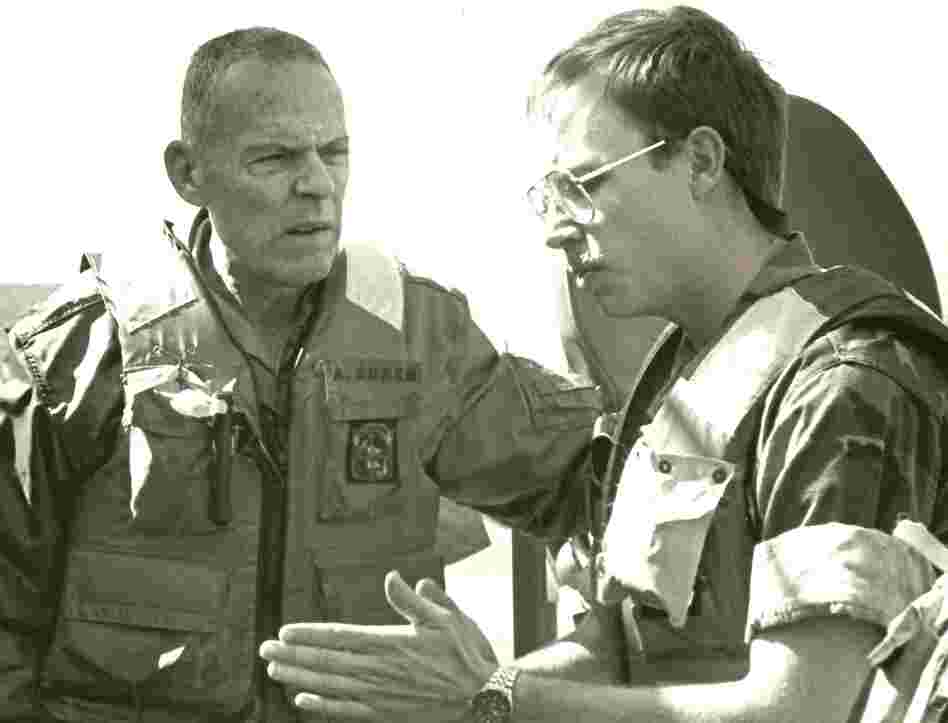 David Crist's father, George (left), discusses operations against Iranian attack boats with Navy Lt. Paul Hillenbrand. George Crist, a Marine Corps general, was commander of CENTCOM from 1985-1988.