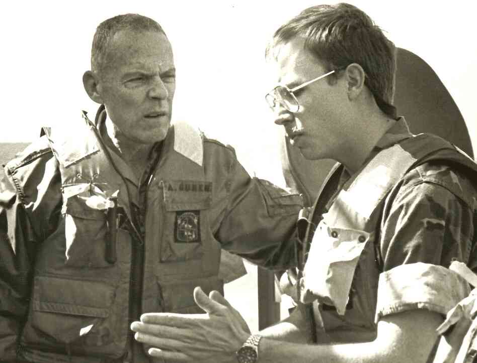 David Crist's father, George (left), discusses operations against Iranian attack boats with Navy Lt. Paul Hillenbrand. George Crist, a Marine Corps general, was commander of CENTCOM from 1985-1988.