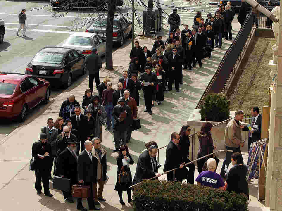 Job seekers wait to attend a job fair in the Brooklyn borough of New York City in 2010.