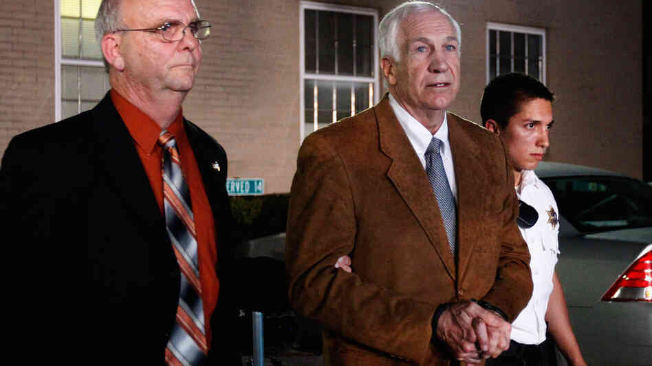 Former Penn State assistant football coach Jerry Sandusky leaves the Centre County Courthouse in handcuffs after a jury found him guilty on 45 of 48 charges in his sex abuse trial in Bellefonte, Pa., Friday.
