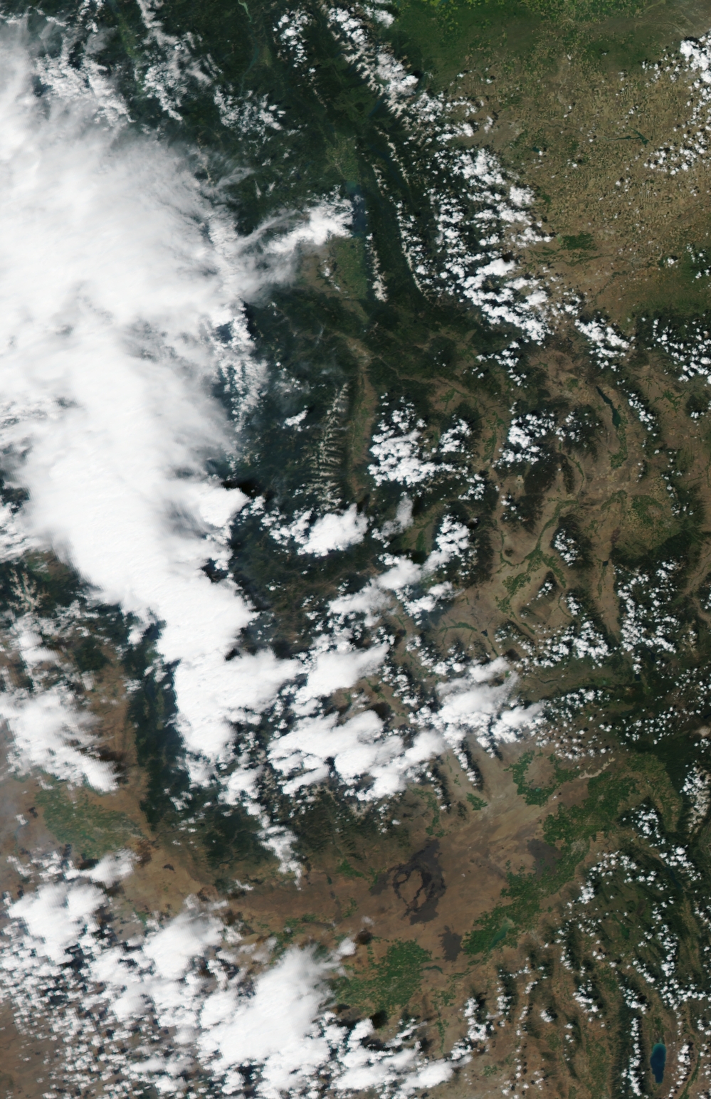 The view from above: A satellite image of Idaho and western Montana, taken Monday and posted by the USDA Forest Services's Active Fire Mapping website, showing smoke and clouds.