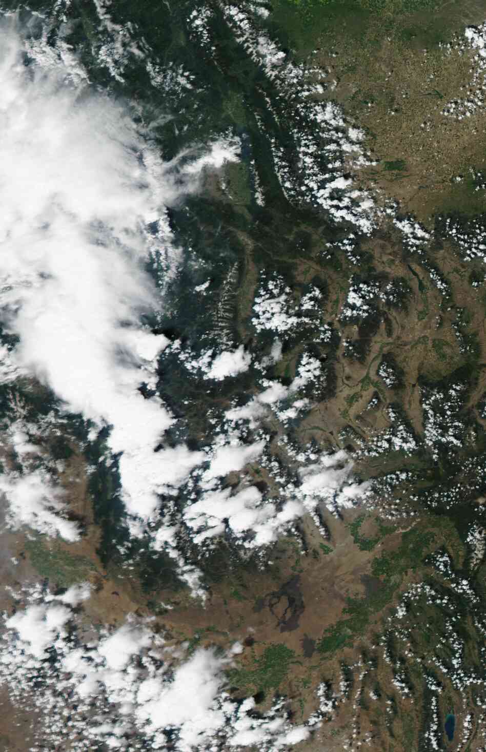 The view from above: A satellite image of Idaho and western Montana, taken Monday and posted by the USDA Forest Services's Active Fire Mapping website, showing smoke and clouds.