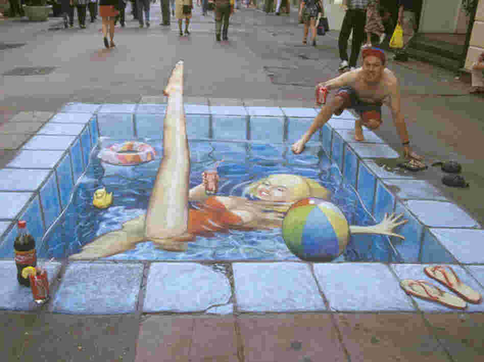 A swimming pool made of chalk in the middle of the street.