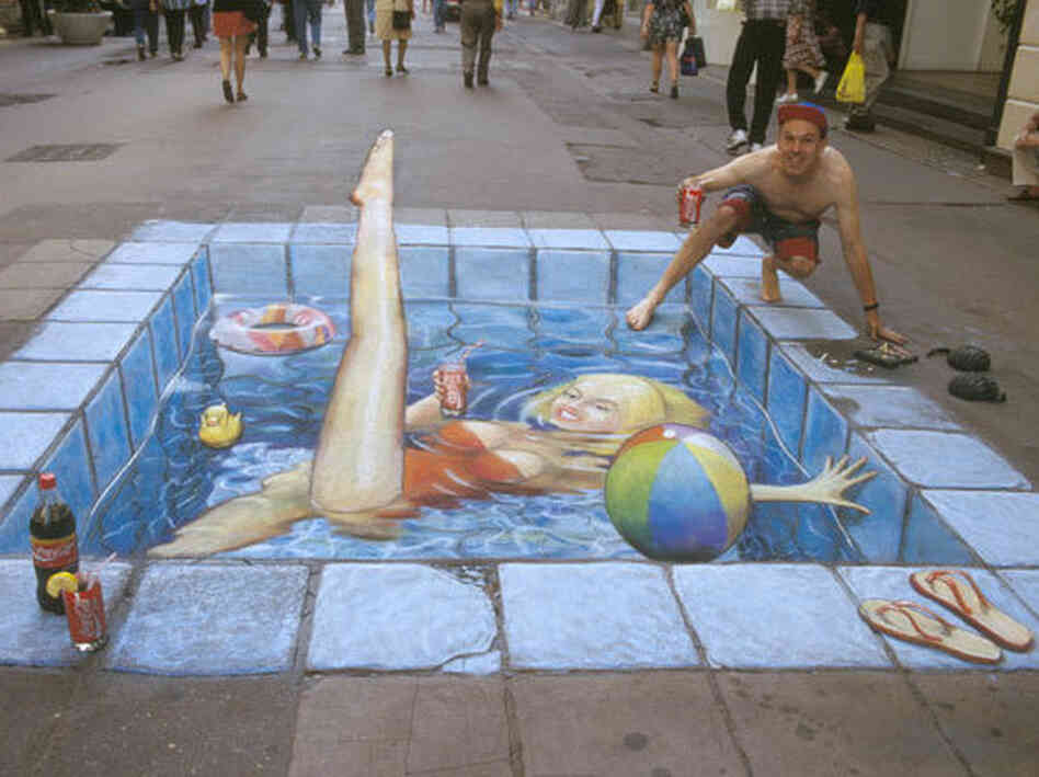 A swimming pool made of chalk in the middle of the street.