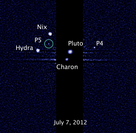 This image, taken by NASA's Hubble Space Telescope, shows five moons orbiting the distant, icy dwarf planet Pluto. The green circle marks the newly discovered moon, designated P5. This image, taken by NASA's Hubble Space Telescope, shows five moons orbiting the distant, icy dwarf planet Pluto. The green circle marks the newly discovered moon, designated P5.