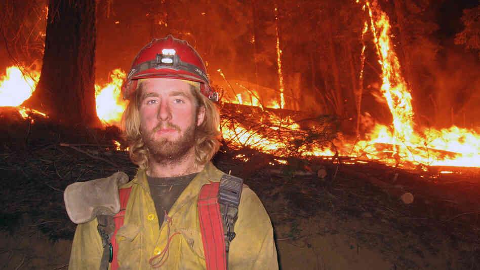Firefighter John Lauer, seen at the scene of a wildfire in Montana, led a campaign for health coverage of seasonal firefighters and their families. Firefighter John Lauer, seen at the scene of a wildfire in Montana, led a campaign for health coverage of seasonal firefighters and their families.