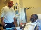 While Kenya Jackson (right) is on his thrice-weekly dialysis treatment, community health worker Greg Jules talks to him about taking his medication. While Kenya Jackson (right) is on his thrice-weekly dialysis treatment, community health worker Greg Jules talks to him about taking his medication.
