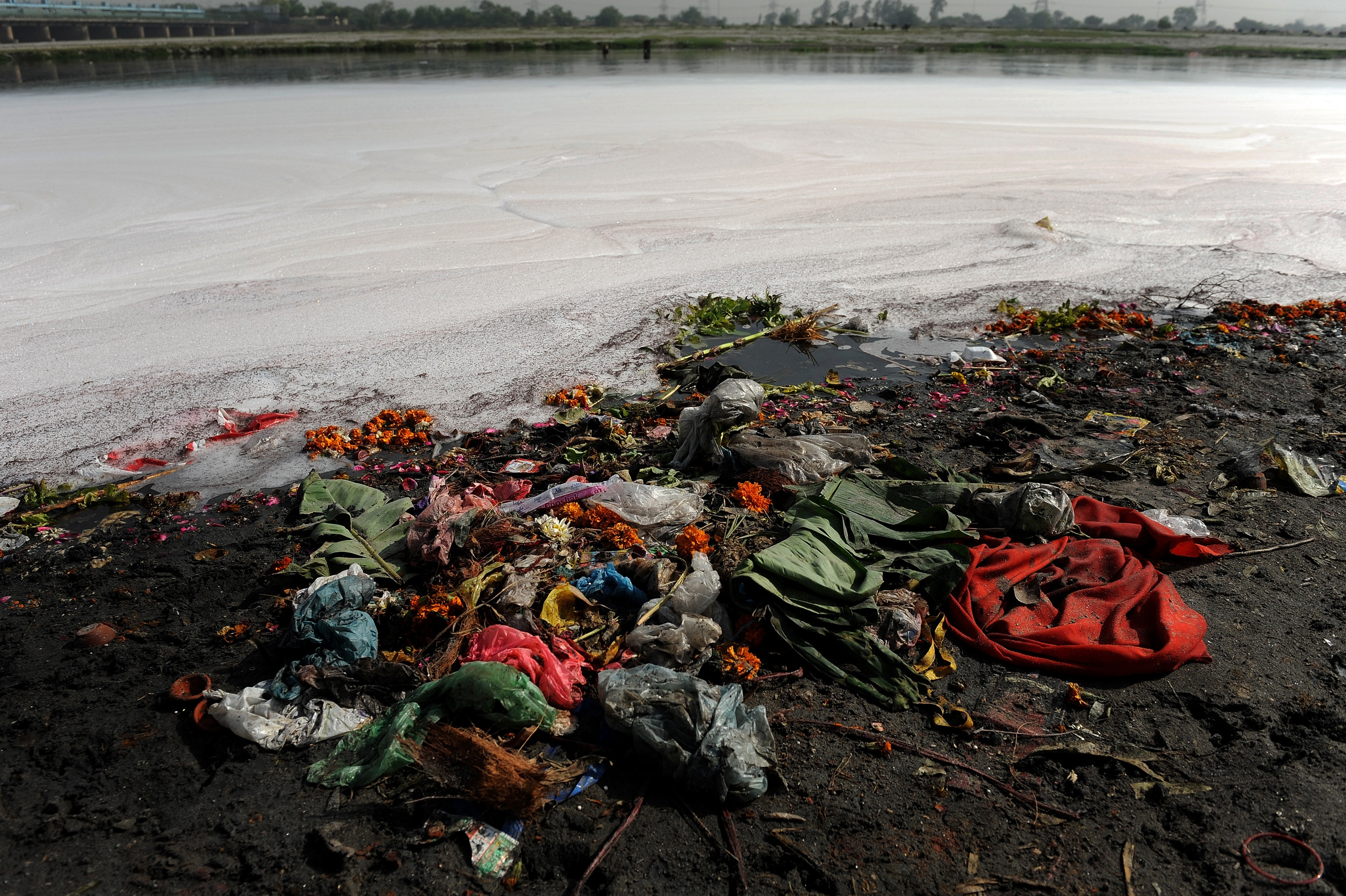Garbage litters the banks of India's holy Yamuna River on World Water Day 2010. For decades, the Yamuna has been dying a slow death from pollution. According to Blackwell, even its most ardent defenders refer to it as a 'sewage drain.' (Image credit: AFP/Getty Images)