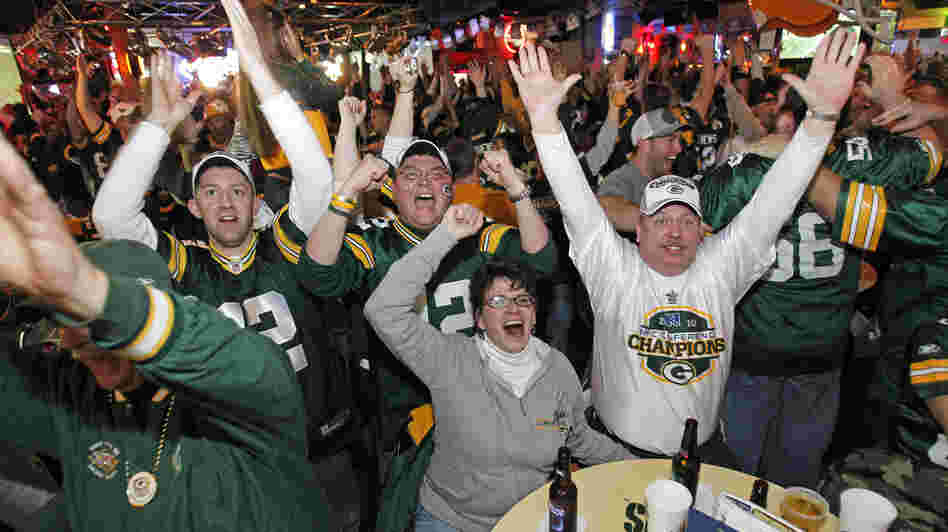 Will these Green Bay fans be cheering as much as they did during the 2011 Super Bowl when their beloved Packer games are interrupted by local political ads this fall?
