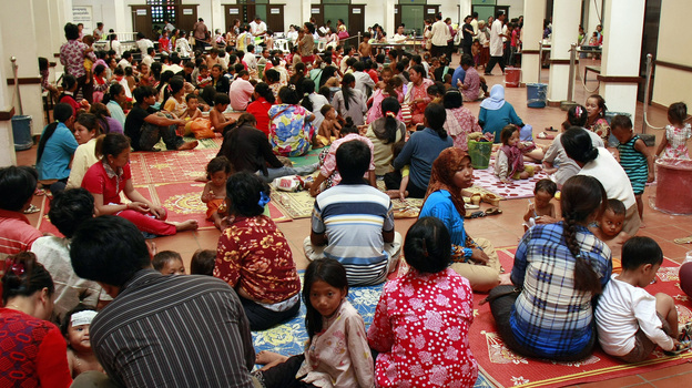 Cambodian children and their parents sitting at Kantha Bopha Children's Hospital in Phnom Penh on July 5.