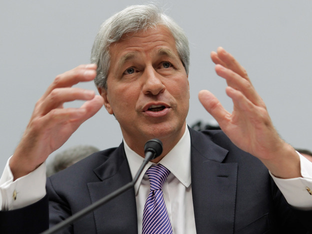 JPMorgan Chase CEO Jamie Dimon, here seen in June testifying before a congressional committee, will try to explain the bank's trading losses to investors on Friday.