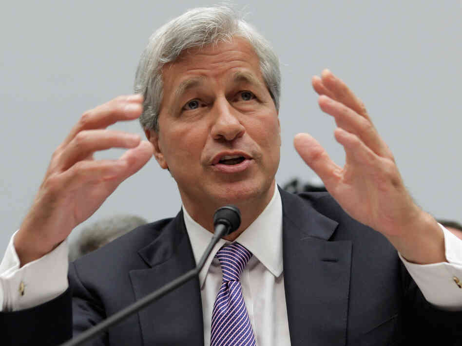 JPMorgan Chase CEO Jamie Dimon, here seen in June testifying before a congressional committee, will try to explain the bank's trading losses to investors on Friday.