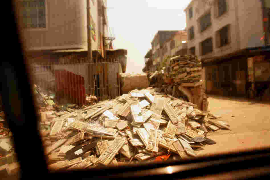Guiyu, China, is known for its electronics recycling workshops, but Blackwell says the town has a strangely rural, even agricultural, feel. "There are giant piles of keyboards, which reminded me a lot of bales of cotton," he says.