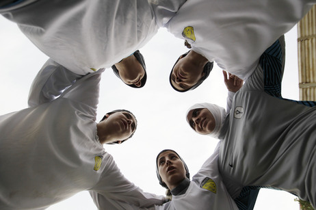 In this May photo, members of a Saudi female soccer team listen to their captain, Rawh Abdullah, before their training session at a secret location in Riyadh. The decision to send female athletes to the Olympics will definitely have consequences at home. In this May photo, members of a Saudi female soccer team listen to their captain, Rawh Abdullah, before their training session at a secret location in Riyadh. The decision to send female athletes to the Olympics will definitely have consequences at home.