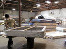 A worker dismantles a mattress at a recycling facility in Oakland, Calif. The material will be used to make carpet products and proceeds will help support the St. Vincent de Paul Society of Lane County, a nonprofit that helps low-income families in Eugene, Ore. A worker dismantles a mattress at a recycling facility in Oakland, Calif. The material will be used to make carpet products and proceeds will help support the St. Vincent de Paul Society of Lane County, a nonprofit that helps low-income families in Eugene, Ore.