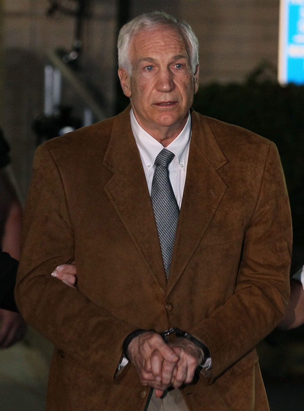 Former Penn State assistant football coach Jerry Sandusky being led away from court after his conviction last month.