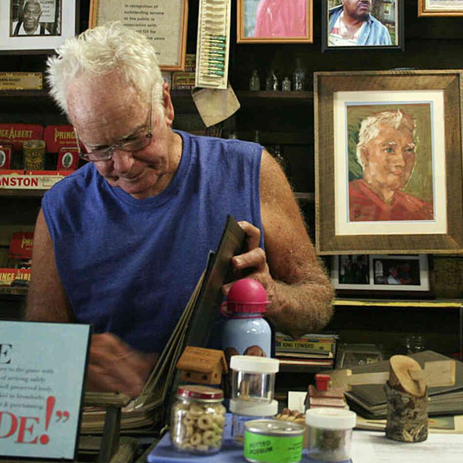 Freddie Wood stands at the counter of the Wood & Swink general store in Evinston, Fla. The store, founded in the late 1800s, houses the oldest post office in Florida.