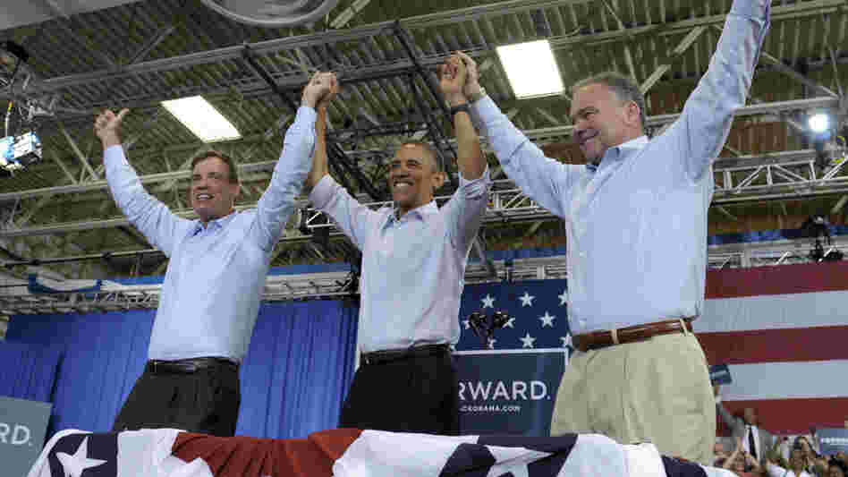 President Obama clasps hands with Sen. Mark Warner (left), D-Va., and Democratic Senate candidate Tim Kaine during a campaign stop Friday in Virginia Beach, Va.