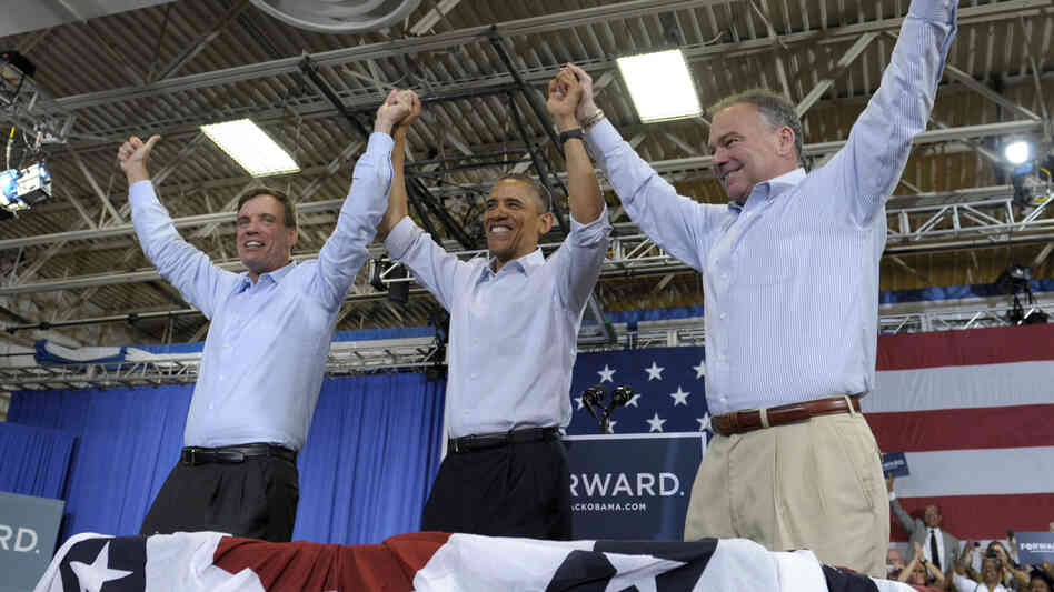 President Obama clasps hands with Sen. Mark Warner (left), D-Va., and Democratic Senate candidate Tim Kaine during a campaign stop Friday in Virginia Beach, Va.