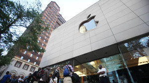 Hundreds of people line up outside an Apple store in Chicago to buy the iPhone 4 in 2010. Apple had removed its products from EPEAT's registry of environmentally friendly electronic devices but later reversed course.