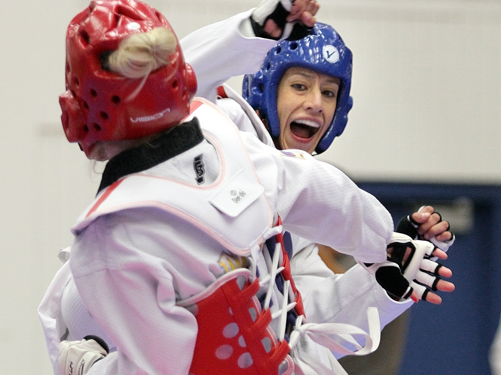 Olympian Diana Lopez (in blue) — not to be confused with the author Diana Lopez — competes in the 2012 Taekwondo Olympic Trials.
