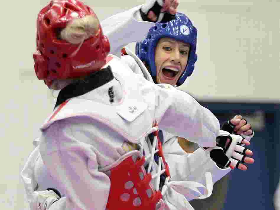 Olympian Diana Lopez (in blue) — not to be confused with the author Diana Lopez — competes in the 2012 Taekwondo Olympic Trials.