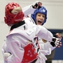 Olympian Diana Lopez (in blue) — not to be confused with the author Diana Lopez — competes in the 2012 Taekwondo Olympic Trials. Olympian Diana Lopez (in blue) — not to be confused with the author Diana Lopez — competes in the 2012 Taekwondo Olympic Trials.