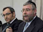 Rabbi Pinchas Goldschmidt, right, president of the Conference of European Rabbis, gestures next to Rabbi Avichai Appel, left, a board member of the Orthodox Rabbinical Conference of Germany, during a news conference in Berlin, Germany on Thursday.