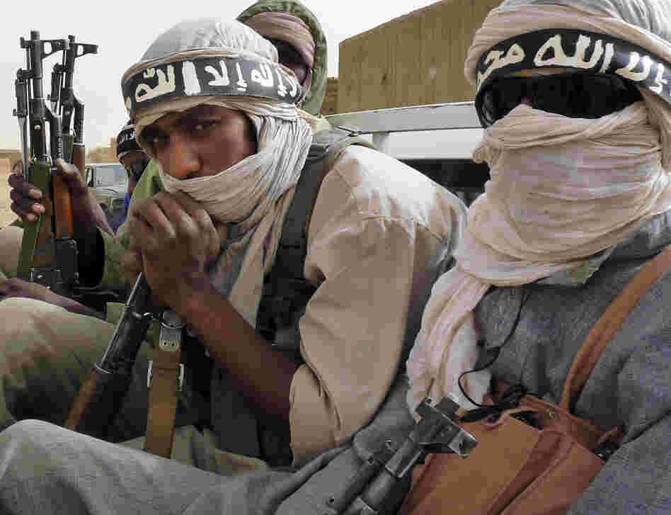 Militiamen from the Ansar Dine Islamic group, an al-Qaida affiliate, ride on a vehicle in northeastern Mali in June. Mali is one of the places where al-Qaida-linked groups are trying to take over territory and win over local residents to their cause. Militiamen from the Ansar Dine Islamic group, an al-Qaida affiliate, ride on a vehicle in northeastern Mali in June. Mali is one of the places where al-Qaida-linked groups are trying to take over territory and win over local residents to their cause.