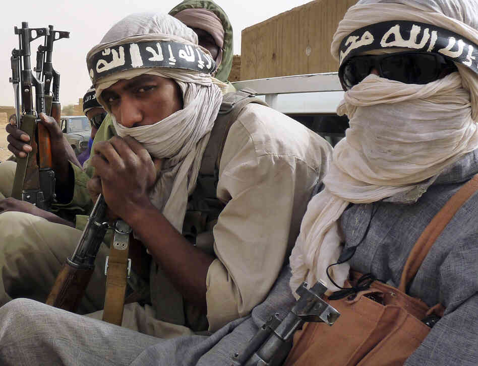Militiamen from the Ansar Dine Islamic group, an al-Qaida affiliate, ride on a vehicle in northeastern Mali in June. Mali is one of the places where al-Qaida-linked groups are trying to take over territory and win over local residents to their cause. Militiamen from the Ansar Dine Islamic group, an al-Qaida affiliate, ride on a vehicle in northeastern Mali in June. Mali is one of the places where al-Qaida-linked groups are trying to take over territory and win over local residents to their cause.