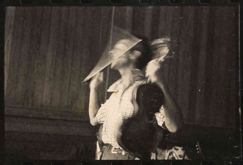 Woody Guthrie performs fiddle tricks at the Music Inn, a carriage house and retreat for New York City intellectuals in Lenox, Mass.