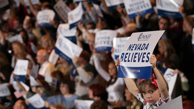 A young supporter of Republican presidential candidate Mitt Romney holds a sign during an election party at the Red Rock Casino in Las Vegas in February.