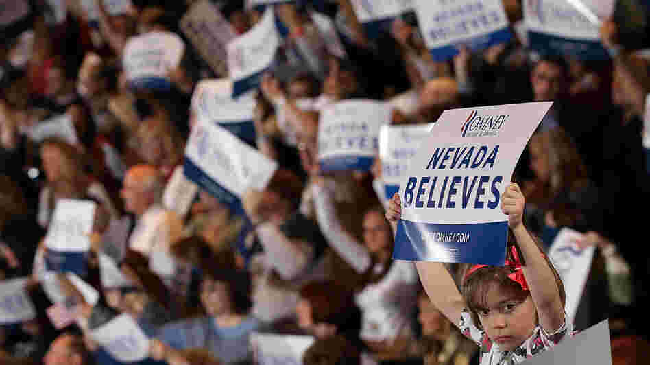 A young supporter of Republican presidential candidate Mitt Romney holds a sign during an election party at the Red Rock Casino in Las Vegas in February.