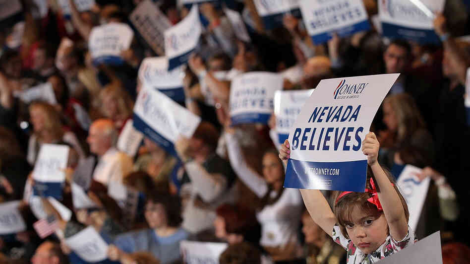 A young supporter of Republican presidential candidate Mitt Romney holds a sign during an election party at the Red Rock Casino in Las Vegas in February.