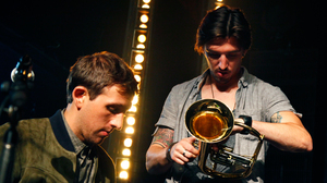 Guitar tech Shane Timm (right) and fun.'s keyboard player Andrew Dost on stage in Brooklyn.