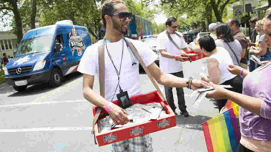 Young activists distribute condoms at an AIDS awareness event in Ashbury Park, N.J.