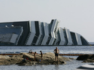 Work has begun to remove the tons of rocky reef embedded into the Concordia cruise ship's hull, off Giglio Island in Italy. The plan is to eventually tow the wreck away from the island in one piece. Work has begun to remove the tons of rocky reef embedded into the Concordia cruise ship's hull, off Giglio Island in Italy. The plan is to eventually tow the wreck away from the island in one piece.