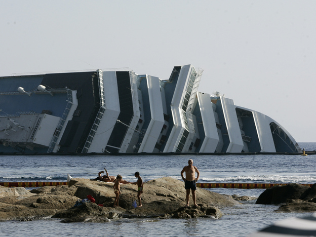 Work has begun to remove the tons of rocky reef embedded into the Concordia cruise ship's hull, off Giglio Island in Italy. The plan is to eventually tow the wreck away from the island in one piece.