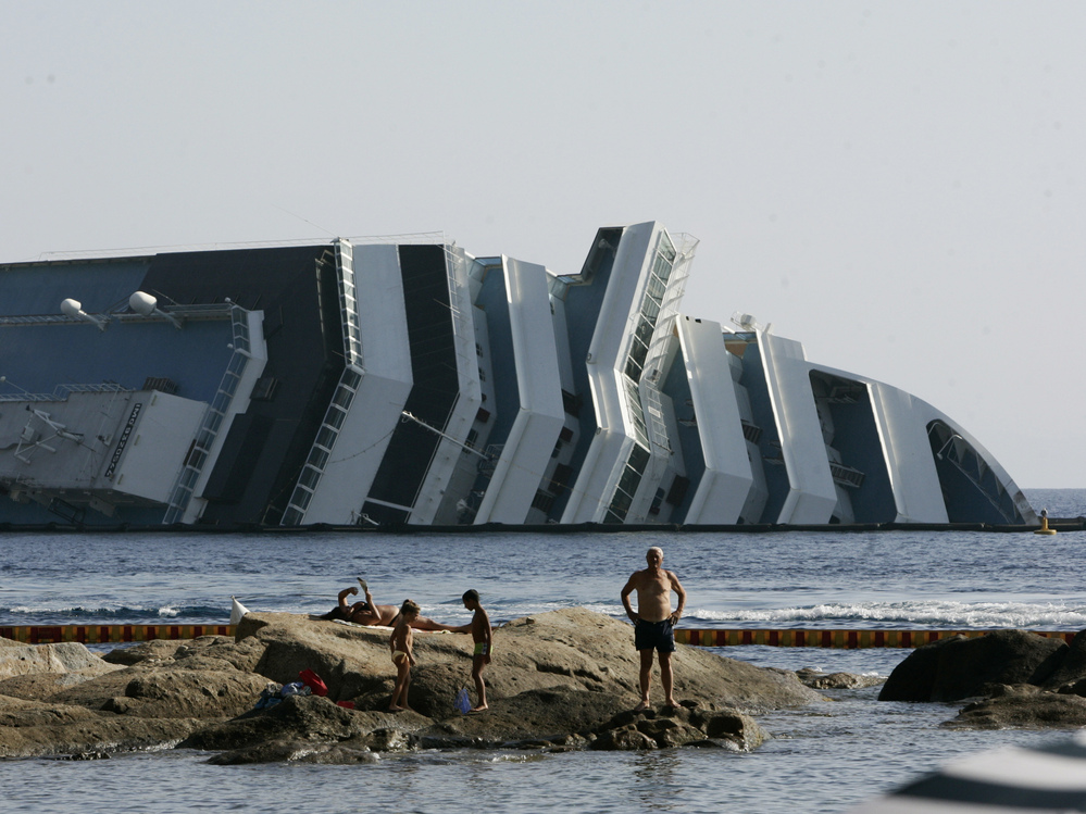 Work has begun to remove the tons of rocky reef embedded into the Concordia cruise ship's hull, off Giglio Island in Italy. The plan is to eventually tow the wreck away from the island in one piece.