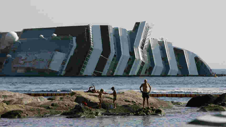 Work has begun to remove the tons of rocky reef embedded into the Concordia cruise ship's hull, off Giglio Island in Italy. The plan is to eventually tow the wreck away from the island in one piece.