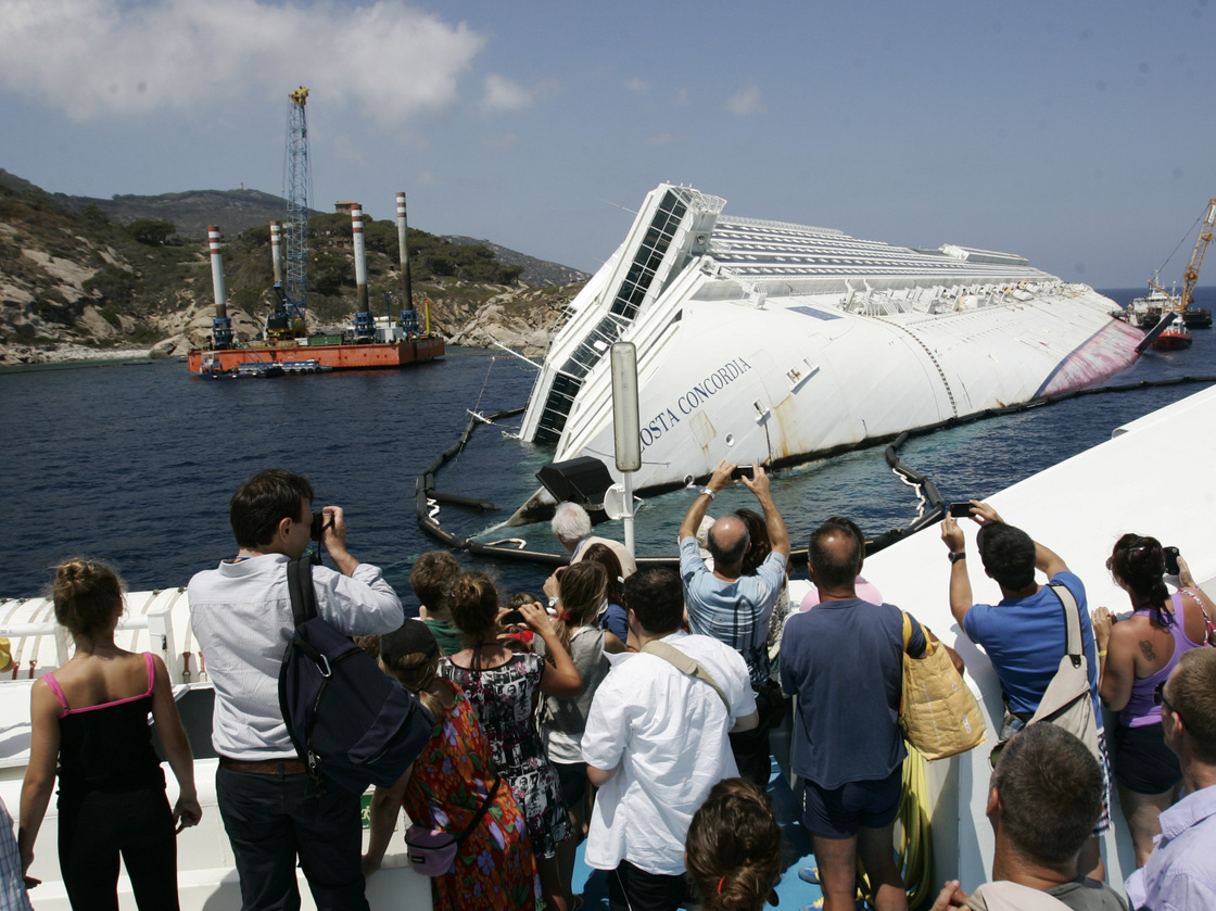 Giglio Island's nature-loving tourists have been replaced by day-trippers who want a look at the massive wreck of the Costa Concordia.