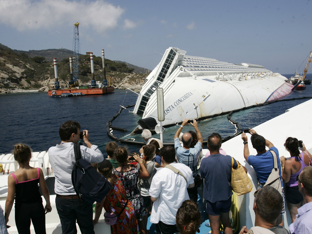 Giglio Island's nature-loving tourists have been replaced by day-trippers who want a look at the massive wreck of the Costa Concordia.
