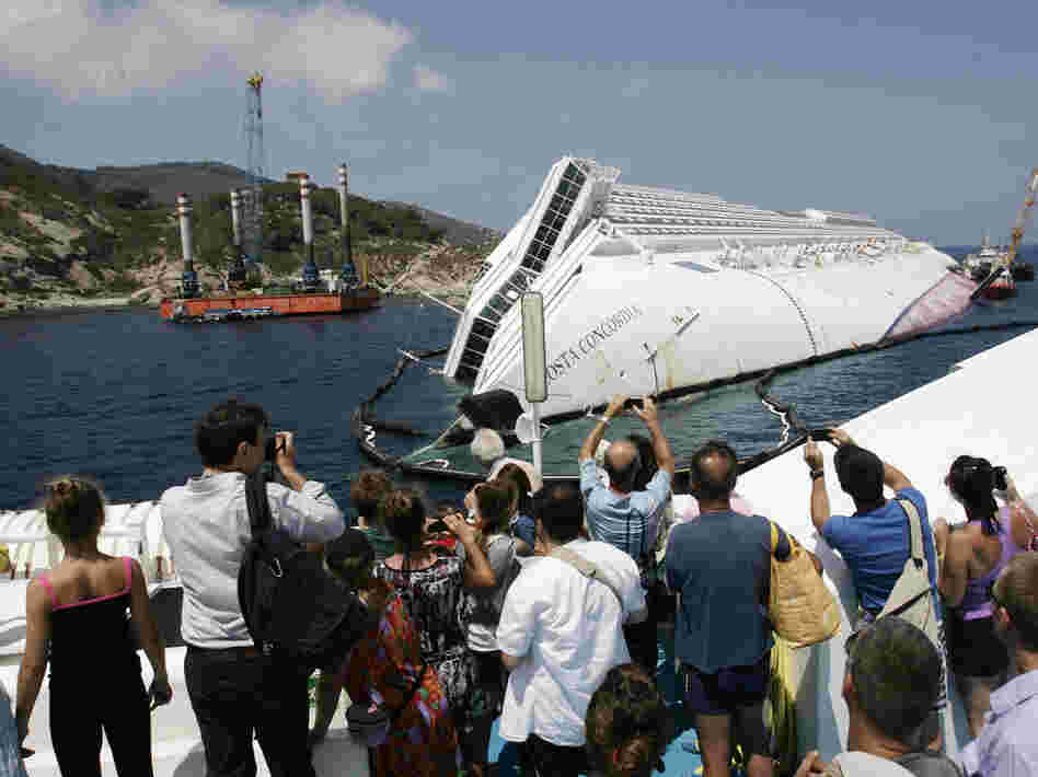 Giglio Island's nature-loving tourists have been replaced by day-trippers who want a look at the massive wreck of the Costa Concordia.