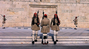 Evzones, the Greek honor guard, watch over Syntagma Square in Athens, the site of numerous anti-austerity protests in the last two years.