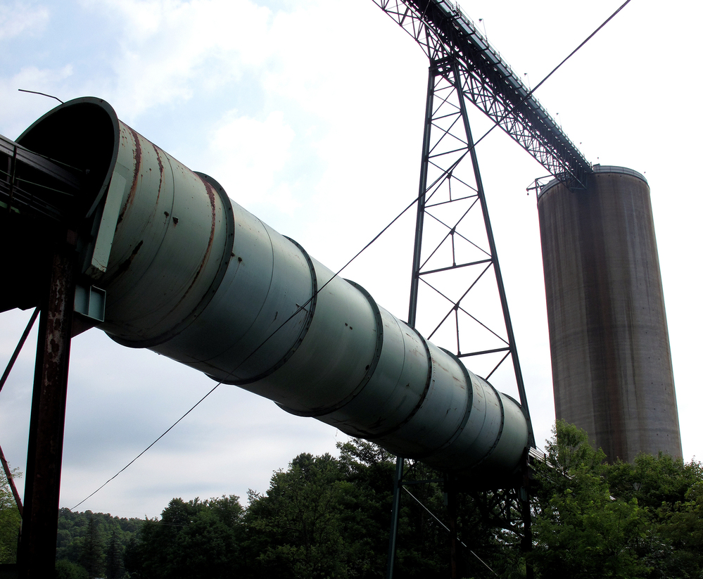 Equipment for transporting and housing coal sits idle in Cowen, W.Va. Since the natural gas boom, several mines in Webster County have either slowed or shut down operation, laying off hundreds of workers.