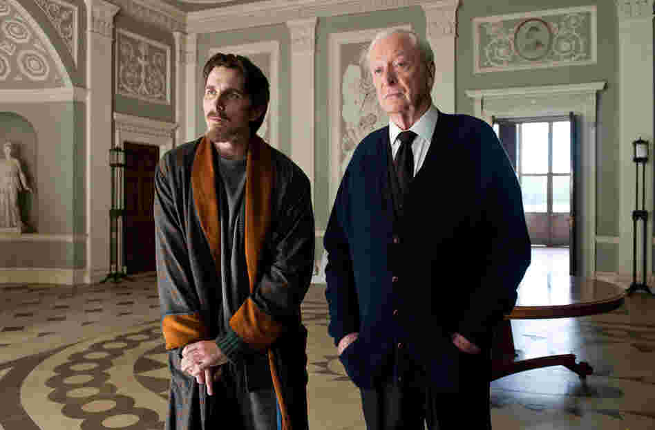 Christian Bale as Bruce Wayne and Michael Caine as Alfred in The Dark Knight Rises.