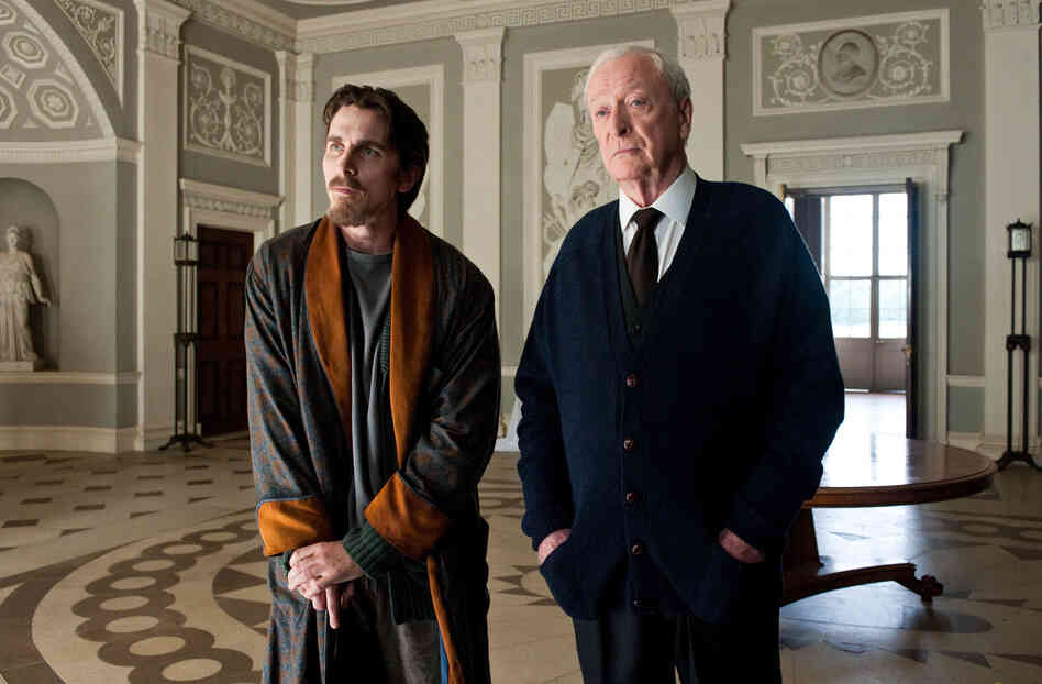 Christian Bale as Bruce Wayne and Michael Caine as Alfred in The Dark Knight Rises.