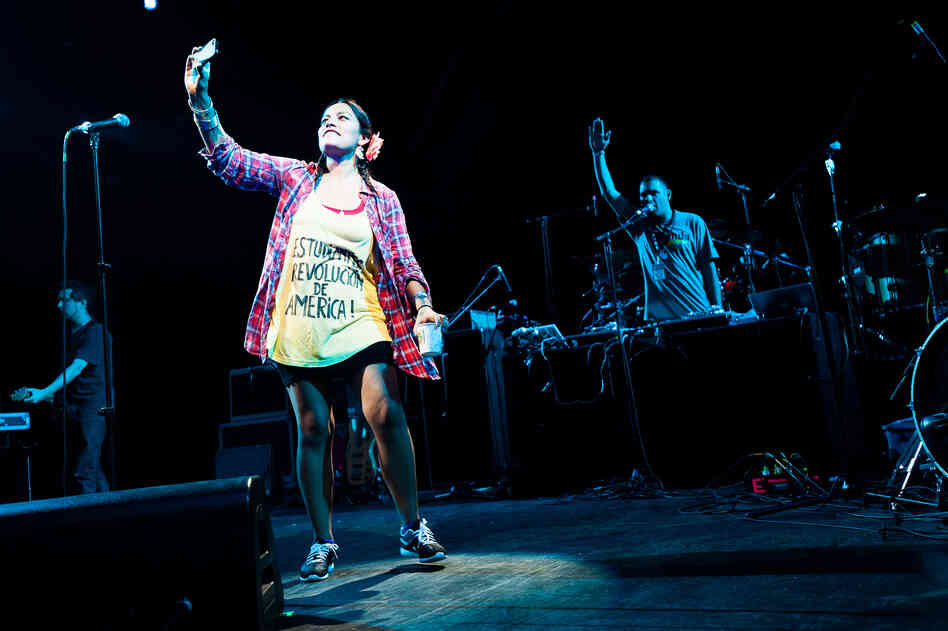 Tijoux took pictures of the crowd as it cheered. More than 7,000 people packed the Prospect Park Bandshell, while just as many were turned away outside.