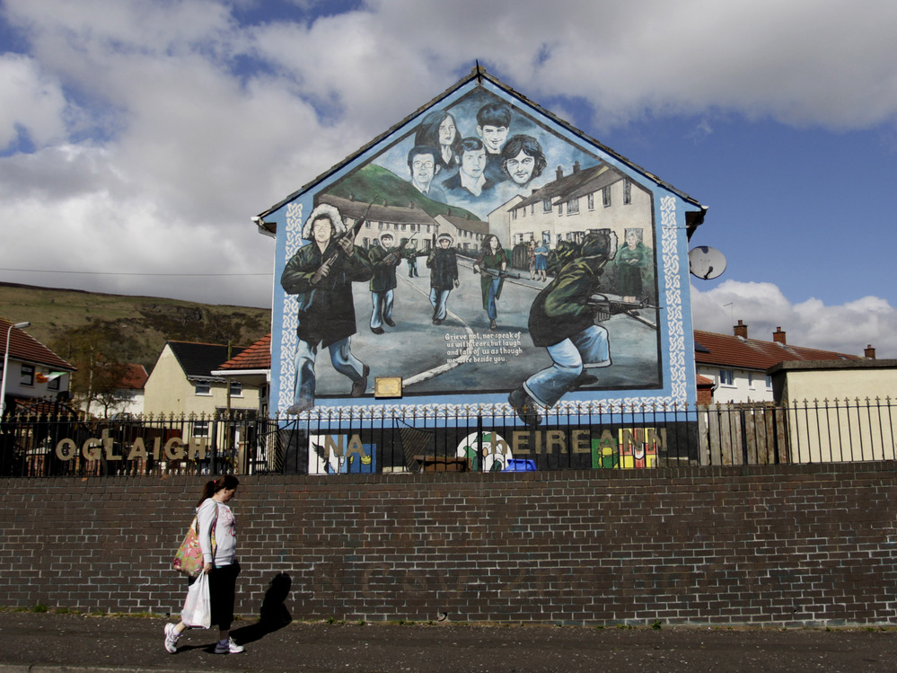 Irish Republican Army murals still loom over streets in West Belfast, where Jean McConville lived until she disappeared in 1972.