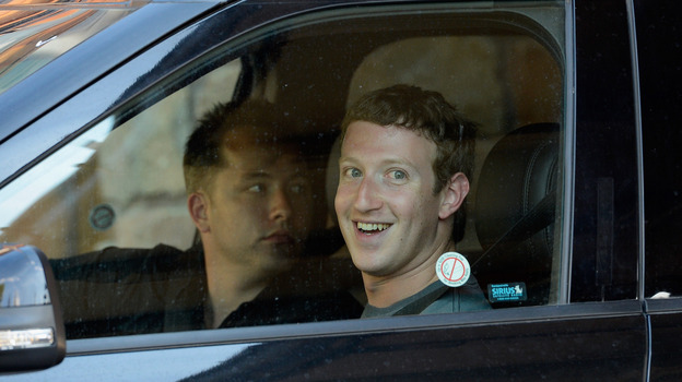 Mark Zuckerberg, right, and Andrew Houston, founder and chief executive of Dropbox, wait in a parked car for the traffic to clear out at the Sun Valley Lodge during the Allen & Company Sun Valley Conference last week.